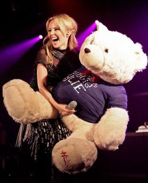 Kylie minogue with a giant teddy bear