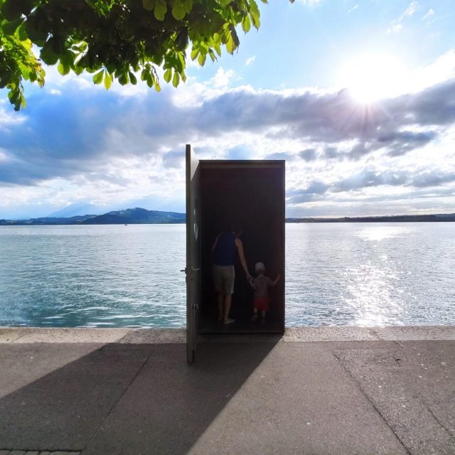 Just a door in the middle of a beautiful scene, makes the background look like a giant wall with a live wallpaper.