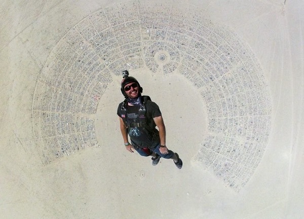 Man skydiving into Burning Man festival