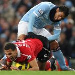  What does your dirty mind think of this unfortunately timed photo of Carlos Tevez and Rio Ferdinand during a match in 2010.