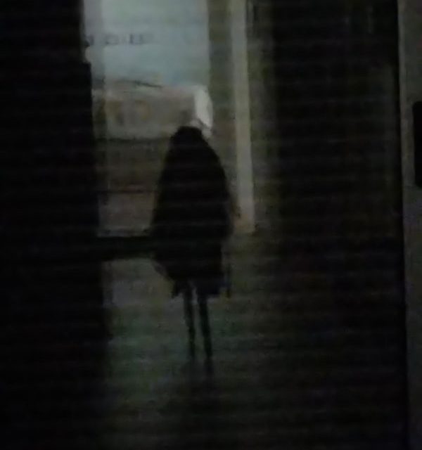 Photo of a ghost of a long-haired girl