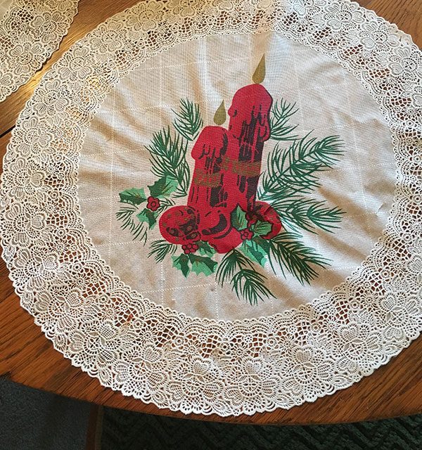 Grandma's placemats with a christmas candle show a dirty optical illusion