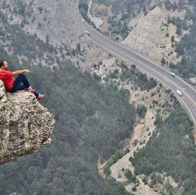 Cliff at great heights above a highway at Gulek Castle, Turkey.