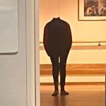 A headless figure