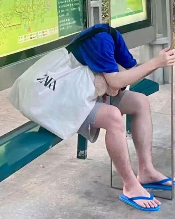 Headless man at bus stop in Singapore