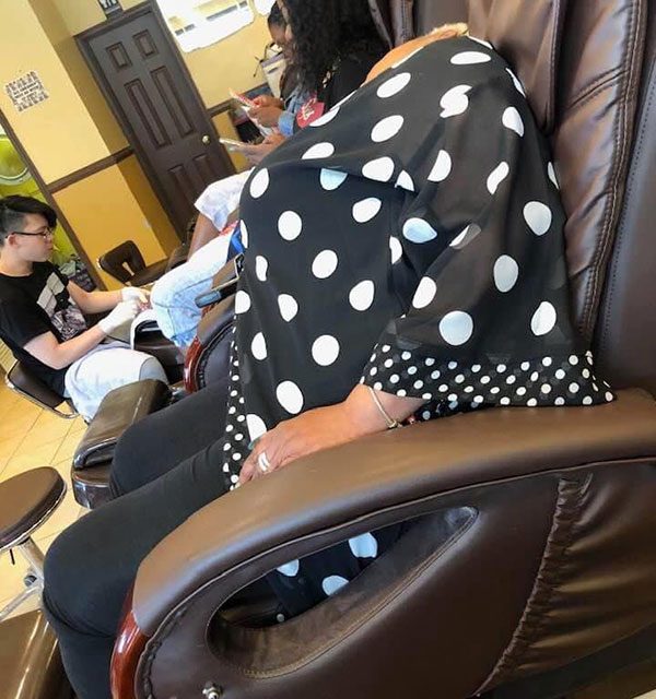 If you look closely at the headless woman, just above the shoulder, you can see an ear.