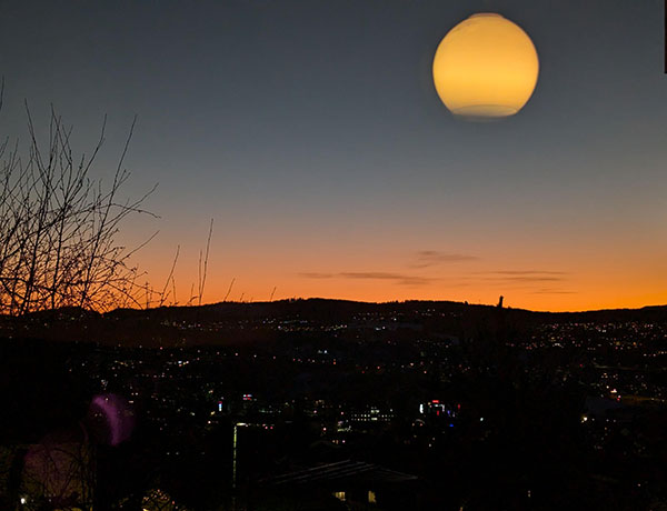 Giant moon reflection optical illusion