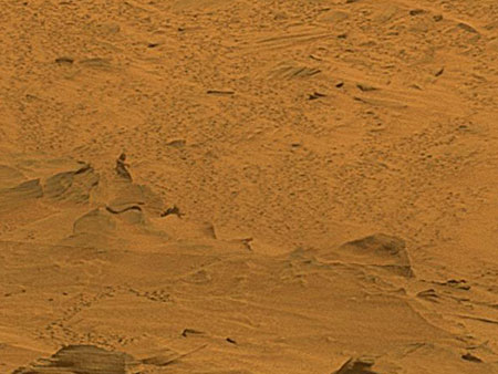 A man sitting on a rock on mars