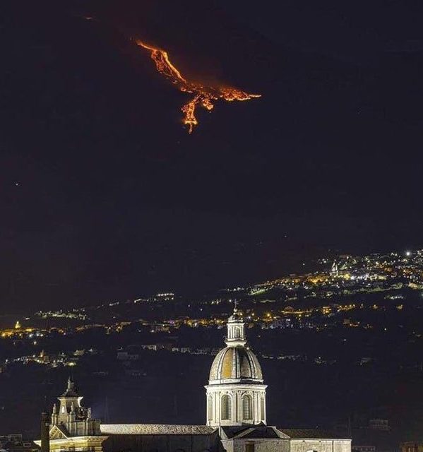 This is the volcano Mount Etna in Sicily erupting. The bright lava against an almost invisible mountain looks like a Phoenix (or Mutalisk)