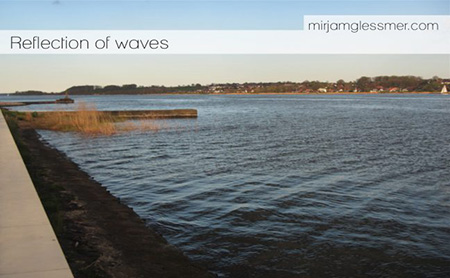 Reflection of surface waves on a sea wall.